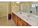 The spacious bathroom features a dual sink vanity and linen closet with doors opening to the toilet at 8107 Crater Lake Dr, Indian Land, SC 29707
