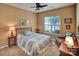 Cozy bedroom with a decorative quilt, neutral walls, and a ceiling fan at 8107 Crater Lake Dr, Indian Land, SC 29707