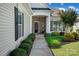 Inviting front porch with decorative landscaping and a charming entrance, perfect for a warm welcome at 8107 Crater Lake Dr, Indian Land, SC 29707
