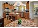 Spacious kitchen with stainless steel appliances, breakfast bar seating, and open view to the dining area at 8107 Crater Lake Dr, Indian Land, SC 29707