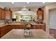 Open kitchen with a center island, stainless steel dishwasher, and a view of the inviting living area at 8107 Crater Lake Dr, Fort Mill, SC 29707