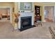 The bright living room is centered around a fireplace with decorative mantle and built-in bookcase at 8107 Crater Lake Dr, Fort Mill, SC 29707