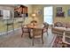 Cozy living space features a dining table, breakfast bar and is decorated in warm, inviting colors at 8107 Crater Lake Dr, Indian Land, SC 29707