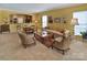Bright living space features a fireplace, breakfast bar, and is decorated in warm, inviting colors at 8107 Crater Lake Dr, Indian Land, SC 29707