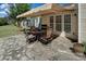 Outdoor patio with stone flooring, awning, barbecue and outdoor table set at 8107 Crater Lake Dr, Indian Land, SC 29707