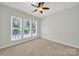 Bright bedroom with plenty of natural light, carpet floors, a ceiling fan and neutral colors at 8107 Crater Lake Dr, Indian Land, SC 29707
