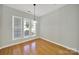 Dining area with hardwood flooring, natural light and hanging light fixture at 8107 Crater Lake Dr, Indian Land, SC 29707