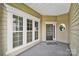 Welcoming covered front porch with large windows and stylish front door at 8107 Crater Lake Dr, Indian Land, SC 29707