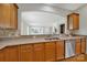 Kitchen with granite countertops, stainless steel dishwasher and wooden cabinets at 8107 Crater Lake Dr, Indian Land, SC 29707