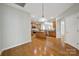 Open kitchen with stainless steel appliances, center island, and hardwood floors at 8107 Crater Lake Dr, Indian Land, SC 29707
