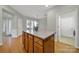 Beautiful kitchen island featuring granite countertop, cabinets and hardwood floors at 8107 Crater Lake Dr, Indian Land, SC 29707