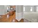 Bright kitchen with hardwood floors, stainless steel appliances, and center island at 8107 Crater Lake Dr, Indian Land, SC 29707