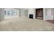 Spacious living room with fireplace, built-in shelves and many windows for ample natural light at 8107 Crater Lake Dr, Indian Land, SC 29707