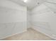 Spacious walk-in closet with neutral carpet and wire shelving for optimal storage solutions at 8107 Crater Lake Dr, Indian Land, SC 29707