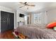 Comfortable bedroom with hardwood floors, ceiling fan, black accent doors and bright natural light at 851 Gist Rd, Rock Hill, SC 29732