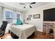 Bedroom with natural light, hardwood floors, and blue accent pillows at 851 Gist Rd, Rock Hill, SC 29732
