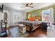 Spacious bedroom features a unique wooden bed frame, hardwood floors, and accent wall at 851 Gist Rd, Rock Hill, SC 29732