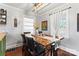 Elegant dining room with a unique wooden table, comfortable seating, and modern light fixture at 851 Gist Rd, Rock Hill, SC 29732