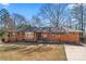 Charming brick home with a manicured front lawn, inviting curb appeal, and a welcoming entrance at 851 Gist Rd, Rock Hill, SC 29732