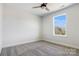 Bedroom featuring neutral walls, plush carpeting, and one large window for natural light at 1044 Margrace Rd, Kings Mountain, NC 28086
