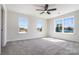 Well lit bedroom with plush carpet and large windows offering lots of natural light at 1044 Margrace Rd, Kings Mountain, NC 28086