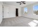 Bright bedroom featuring plush carpet, ceiling fan and access to the en suite bathroom at 1044 Margrace Rd, Kings Mountain, NC 28086