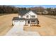 New construction featuring a welcoming front porch and a three car attached garage at 1044 Margrace Rd, Kings Mountain, NC 28086