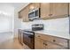 Modern kitchen with stainless steel appliances and neutral-toned cabinets at 1044 Margrace Rd, Kings Mountain, NC 28086