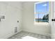 Laundry room with a large window and patterned tile floor at 1044 Margrace Rd, Kings Mountain, NC 28086