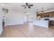 Spacious living room with light wood floors and modern ceiling fan at 1044 Margrace Rd, Kings Mountain, NC 28086