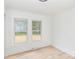 Bright bedroom featuring hardwood floors and large windows at 108 Arlene Ave, Kannapolis, NC 28081