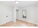 Bright bedroom with neutral paint, wood flooring, a closet, and a window at 108 Arlene Ave, Kannapolis, NC 28081