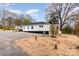 Side exterior view of a home with black and white trim and a new porch at 108 Arlene Ave, Kannapolis, NC 28081