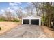Two-car detached garage with black doors and ample driveway parking space at 108 Arlene Ave, Kannapolis, NC 28081