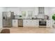 Bright kitchen featuring stainless steel appliances, black hardware, and light wood flooring at 108 Arlene Ave, Kannapolis, NC 28081