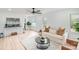 Bright living room featuring hardwood floors, white walls, modern fan and lots of natural light at 108 Arlene Ave, Kannapolis, NC 28081