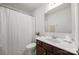 Bright bathroom with a white vanity, matching mirror, and a shower with white curtain at 11207 Argosy Dr, Lancaster, SC 29707