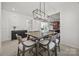 Elegant dining area with modern lighting, flowing into the kitchen and living spaces at 11207 Argosy Dr, Lancaster, SC 29707