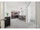 Open-concept dining room with a modern light fixture and seamless transition to the kitchen area at 11207 Argosy Dr, Lancaster, SC 29707