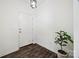 Clean entryway with a dark wood floor, white walls, and a simple, modern light fixture at 11207 Argosy Dr, Lancaster, SC 29707