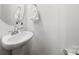 Well-lit half bath featuring a clean white sink and modern fixtures, ideal for guests at 11207 Argosy Dr, Lancaster, SC 29707