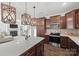 Modern kitchen features stainless steel appliances, dark wood cabinets, and stylish wooden light fixtures at 11207 Argosy Dr, Lancaster, SC 29707