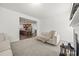 Bright living room showcasing an open floor plan that leads to a modern kitchen at 11207 Argosy Dr, Lancaster, SC 29707