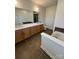 Luxurious bathroom boasting double vanity, soaking tub, and tile flooring at 121 Irving Ave, Mooresville, NC 28117