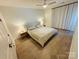 Spacious bedroom features stylish decor, hardwood floors and a serene ambiance at 121 Irving Ave, Mooresville, NC 28117