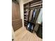 Well-organized walk-in closet with custom shelves, rods and drawers for ample storage at 121 Irving Ave, Mooresville, NC 28117
