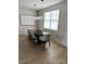Dining room features modern lighting, a large window, and stylish decor creating an inviting atmosphere at 121 Irving Ave, Mooresville, NC 28117