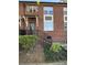 Charming brick townhome featuring a quaint front entrance and well-maintained landscaping at 121 Irving Ave, Mooresville, NC 28117