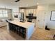 Open concept kitchen with center island, modern appliances, and great lighting for seamless entertaining at 121 Irving Ave, Mooresville, NC 28117