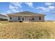 Expansive backyard with patio area perfect for outdoor dining and entertaining at 156 Sugar Hill Rd, Troutman, NC 28166